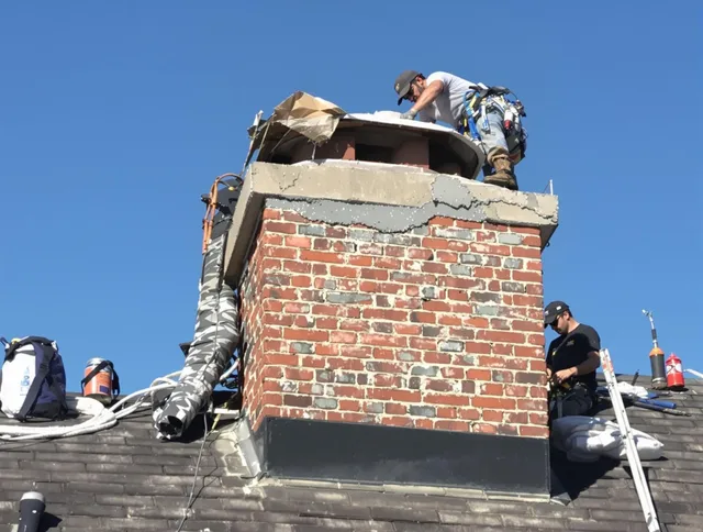 Spring Hill Chimney Sweep installing a custom chimney crown in Spring Hill, FL