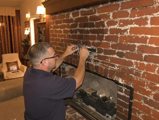 Spring Hill Chimney Sweep expert fixing a fireplace in Spring Hill, FL